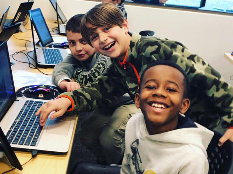 Boys using a laptop